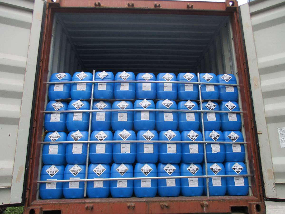 Phosphoric Acid vs. Sulfuric Acid: Which to Choose? 19 A container being loaded with chemical containers at a busy Chinese port for international export.
