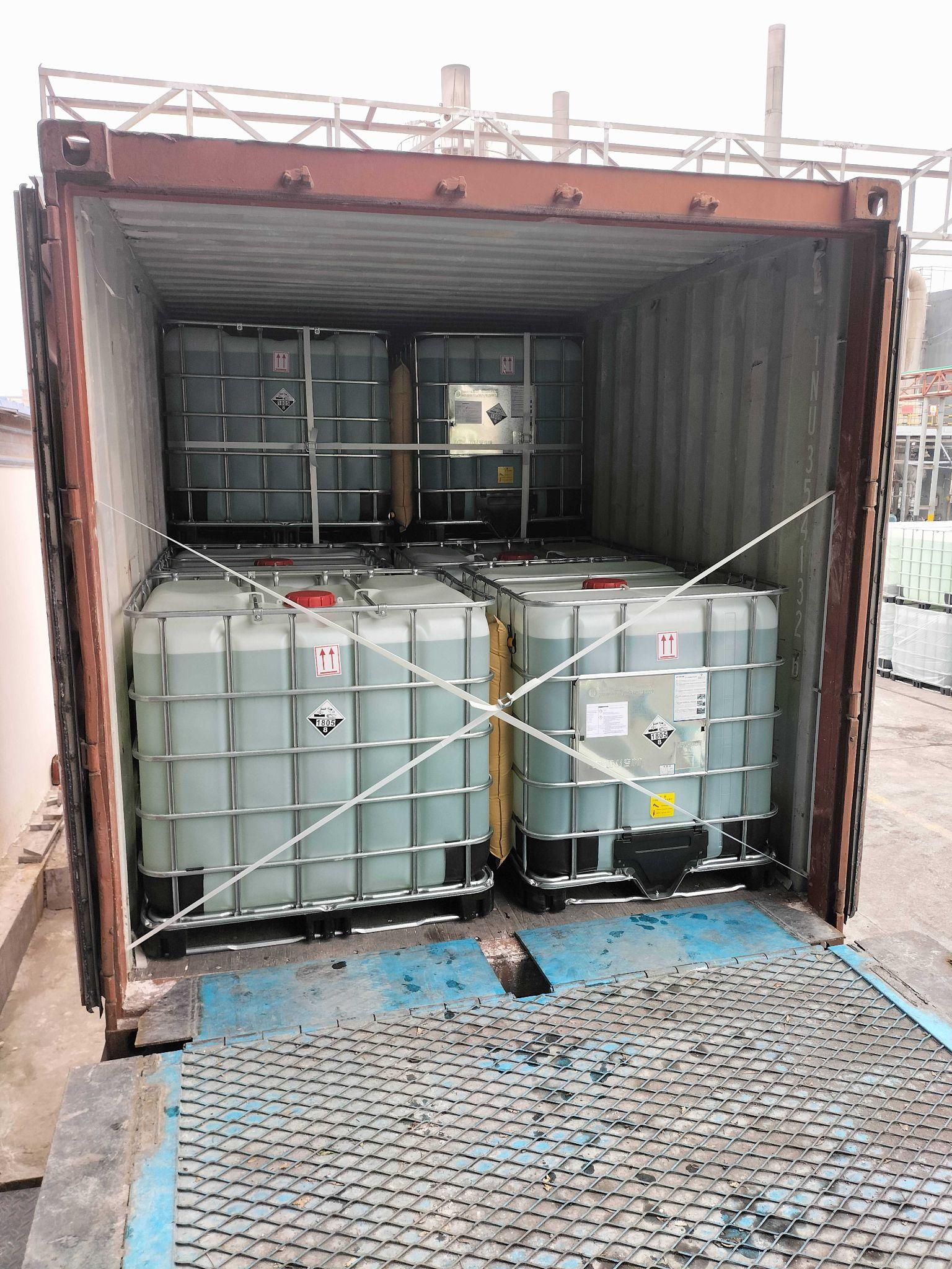 An IBC container used for bulk phosphoric acid handling.