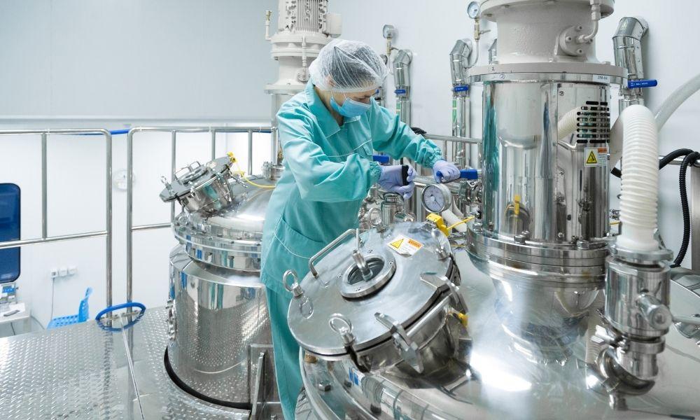 Laboratory chemist conducting purity analysis and quality control testing on liquid phosphoric acid samples