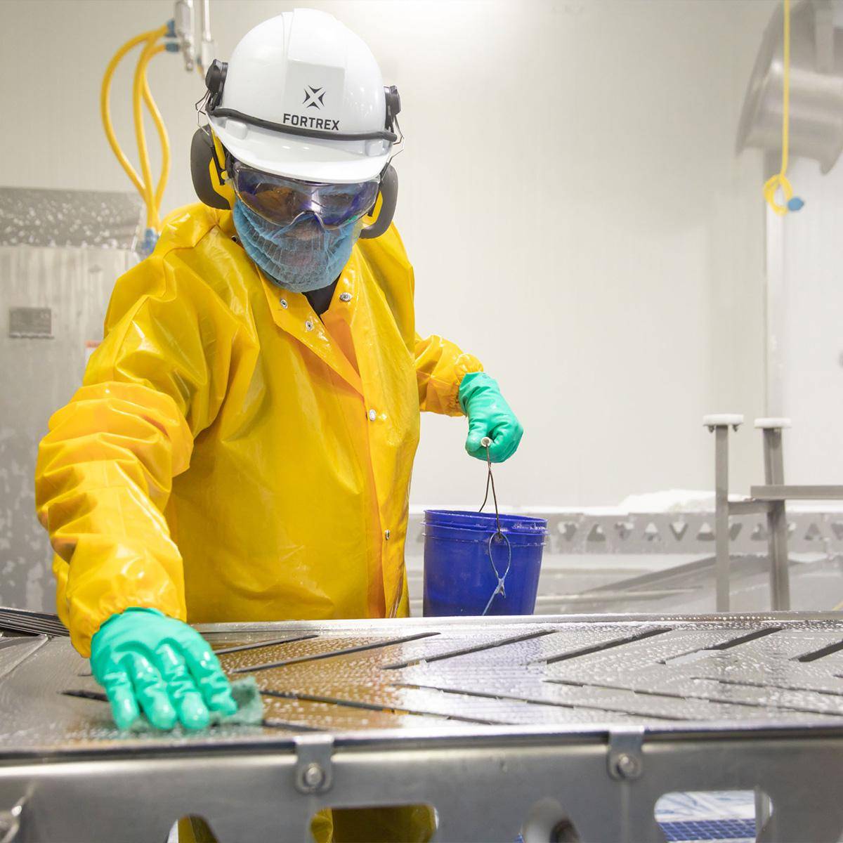 Phosphoric Acid in Metal Cleaning and Rust Removal 1 An Asian technician using a cloth to wipe a clean metal surface with phosphoric acid solution before welding.