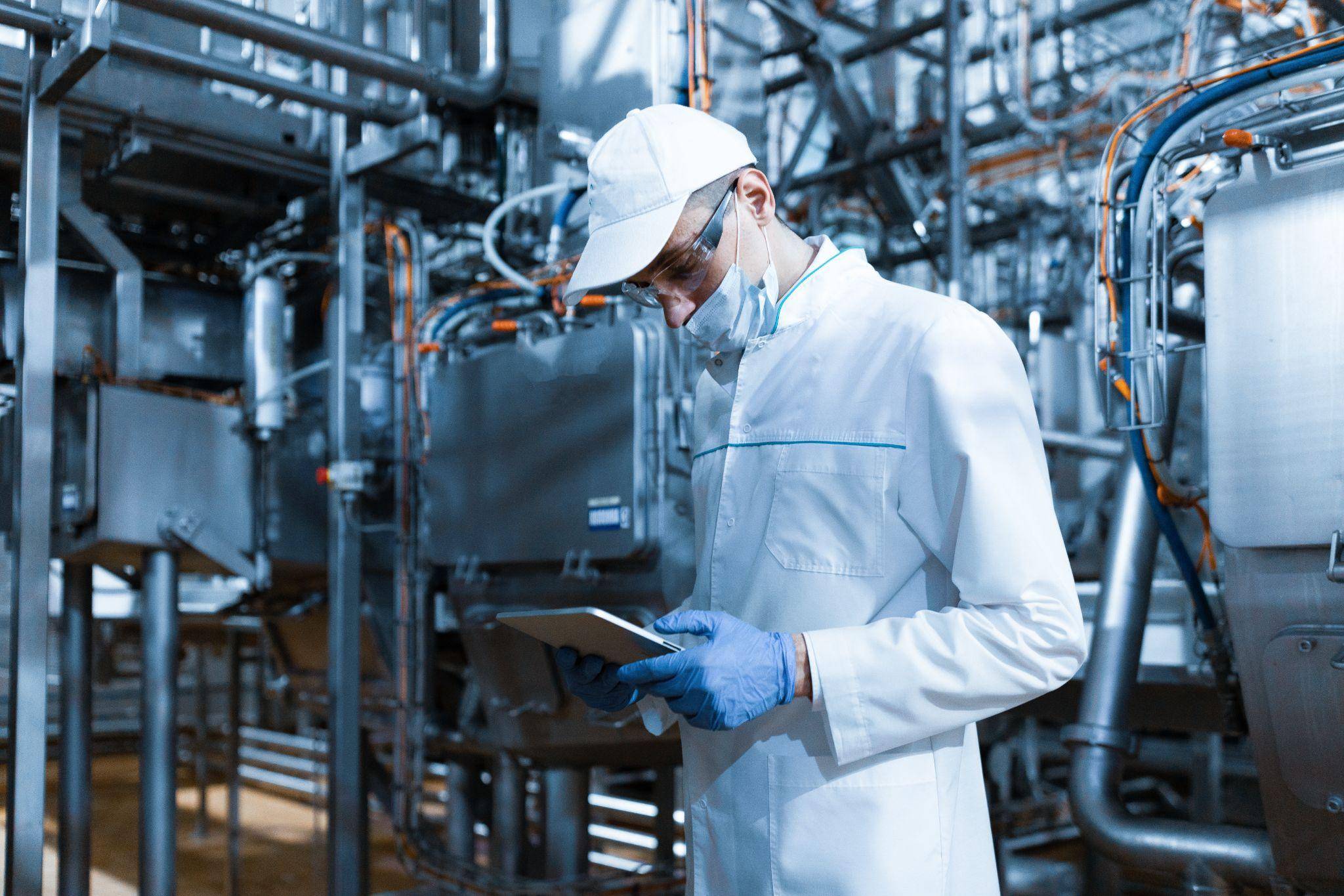 A professional Asian Chinese laboratory researcher reviewing a detailed chemical analysis report on a tablet. The screen shows a bar chart with several bars exceeding the 'Standard Limit' line. They are working in a modern chemical lab. Focused, professional, photorealistic.