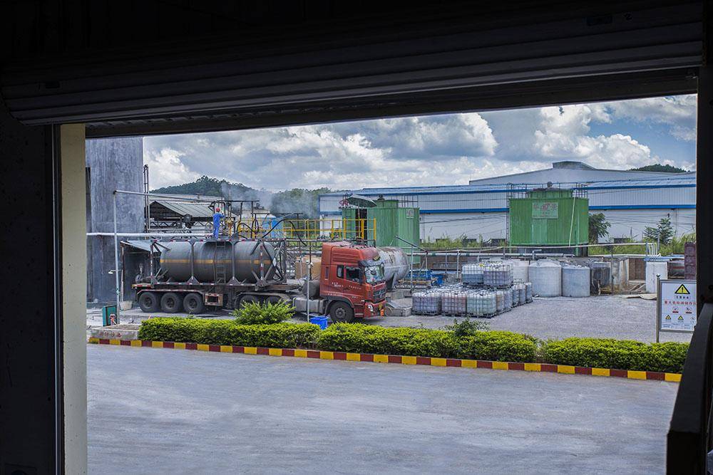 Phosphoric acid manufacturer loading dock with export cargo prepared for container shipment.